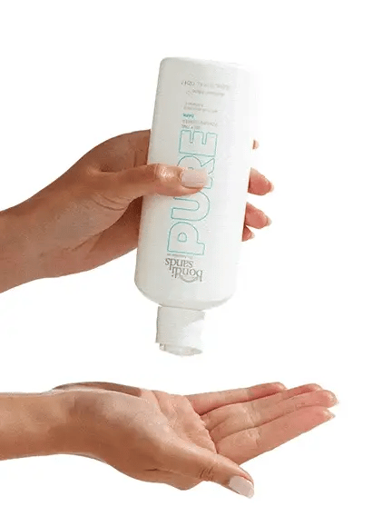 Bondi Sands Pure Self Tan Water Dark pump dispensing tanning water in GIF for hydration, glow, and dark self-tan application