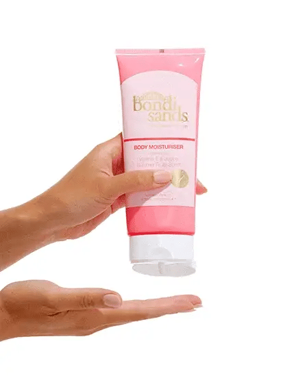Bondi Sands Summer Fruits Moisturiser being dispensed, light fruity formula for glowing, soft skin and daily hydration care