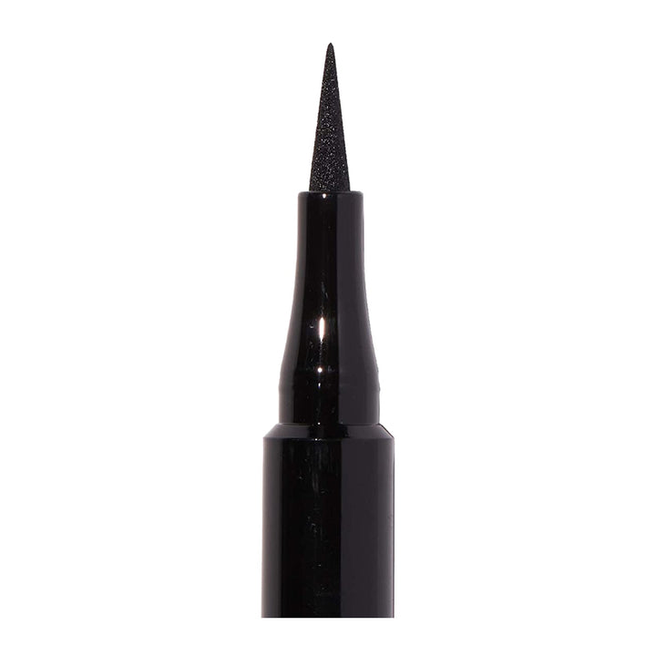 Close-up of Revlon Sharp Line Liquid Eye Pen tip with slim tapered felt tip for precise black eyeliner definition